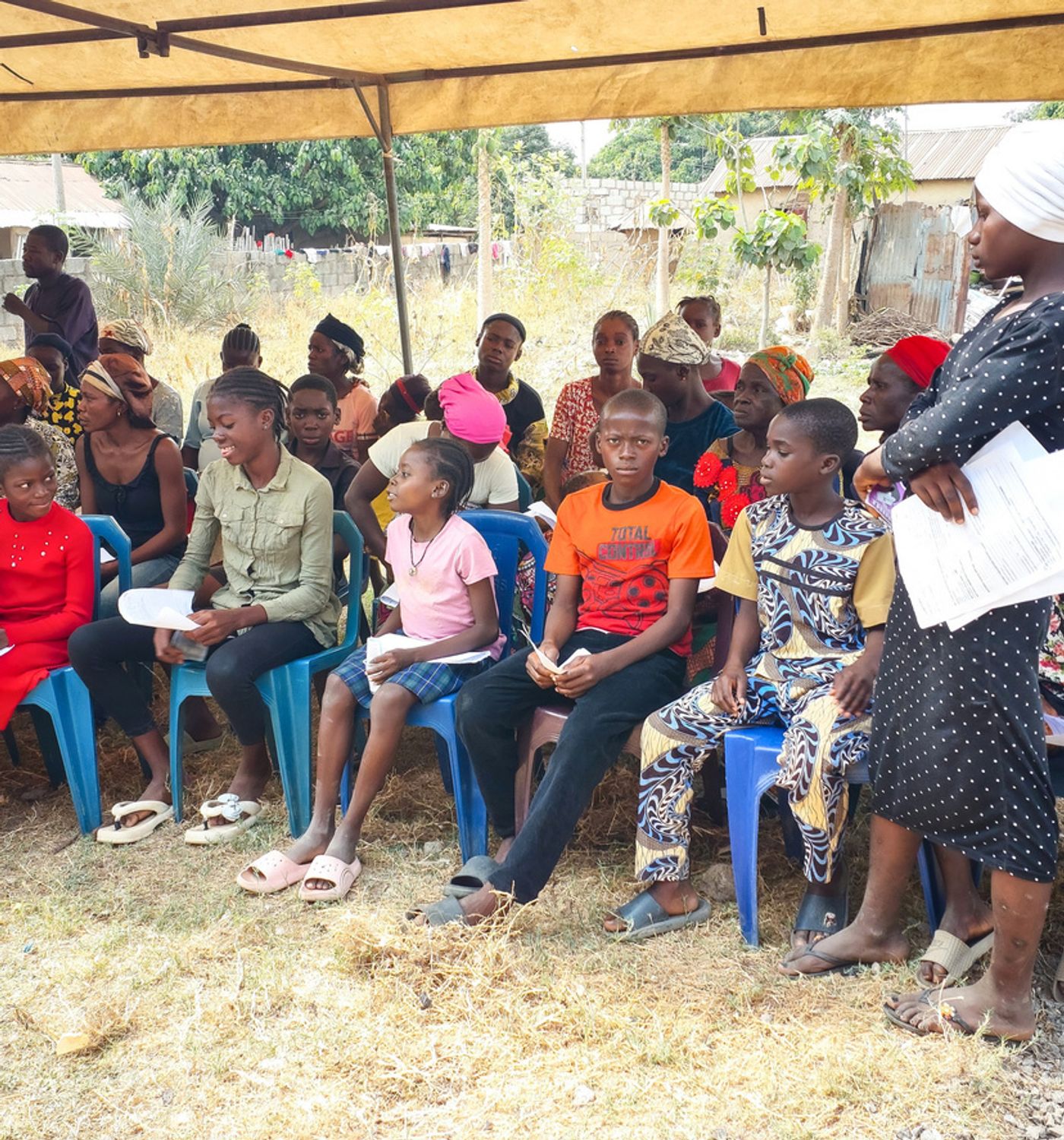 Community members gathered for the MedWHOLE Kunyami Health Outreach