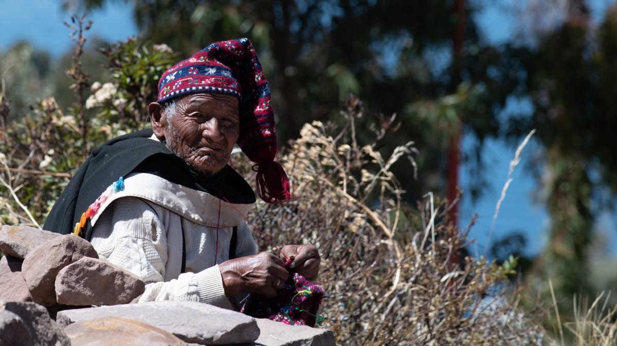 Peruvian man knitting