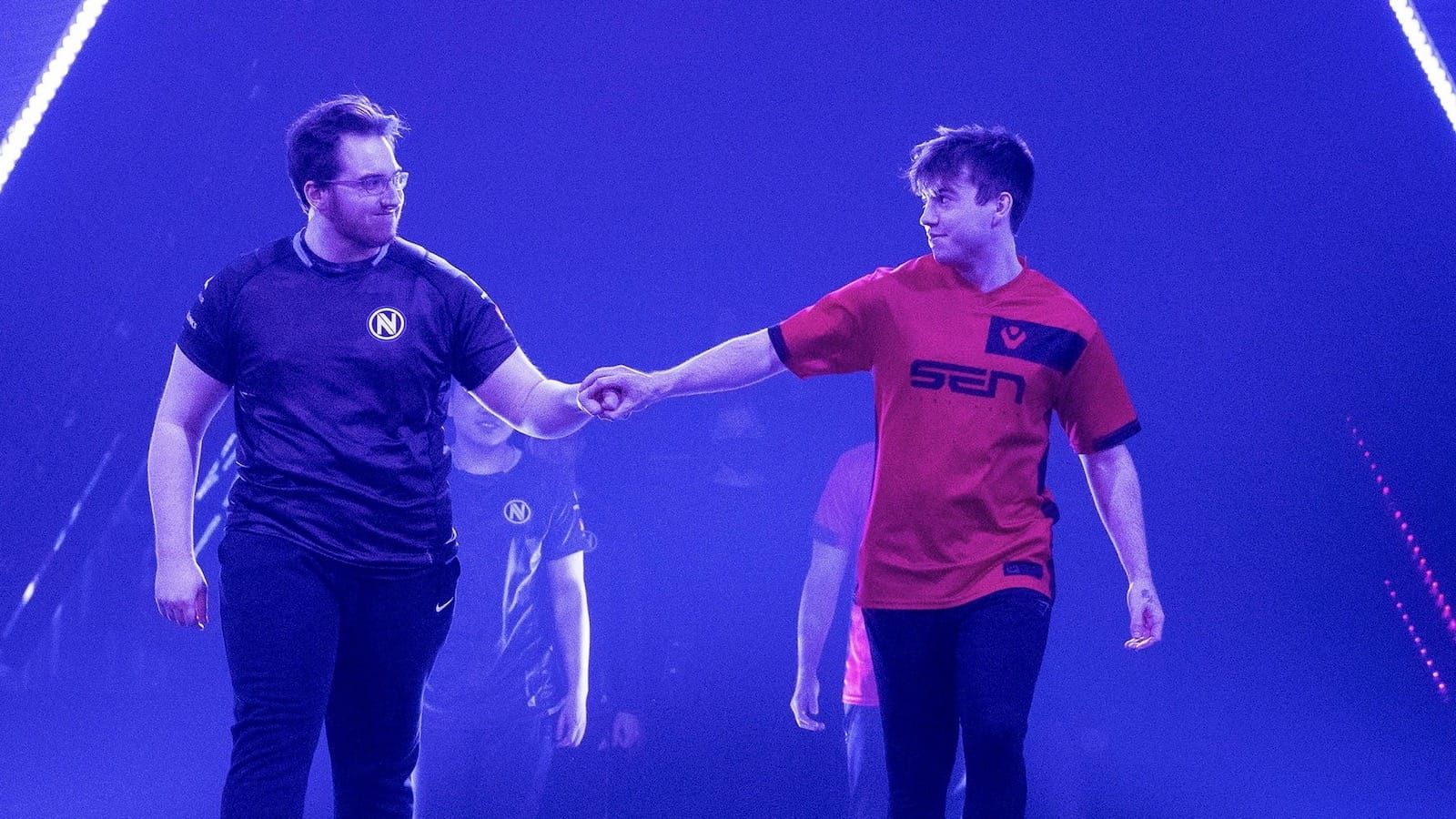 Envy player yay (left) and Sentinels player dapr (right) bump fists as they walk out on stage