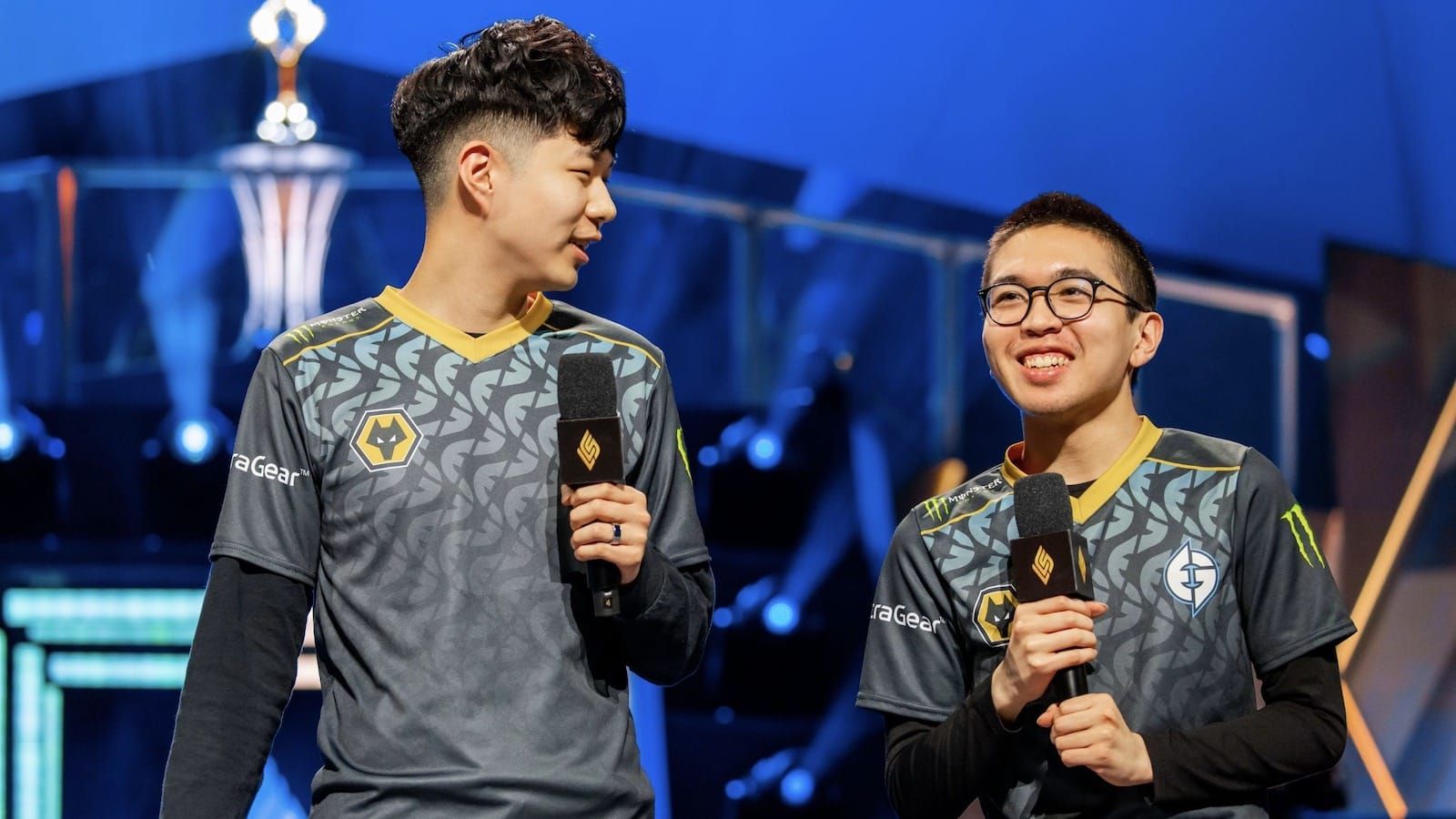 Evil Geniuses League of Legends players jojopyun and Danny holding microphones as they get interviewed on stage