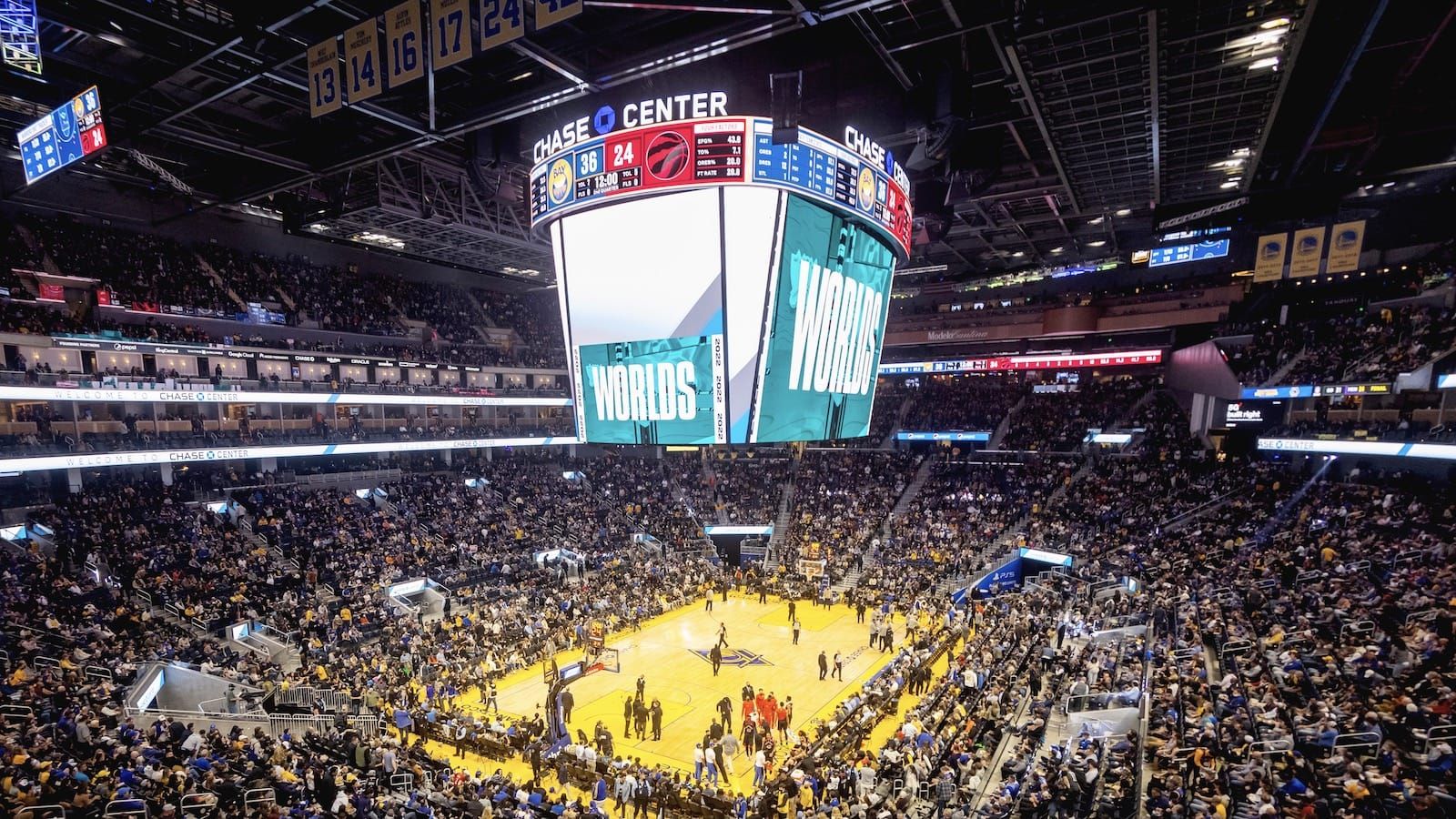 view from above of the Golden State Warriors basketball court with "Worlds" written on the giant scoreboard