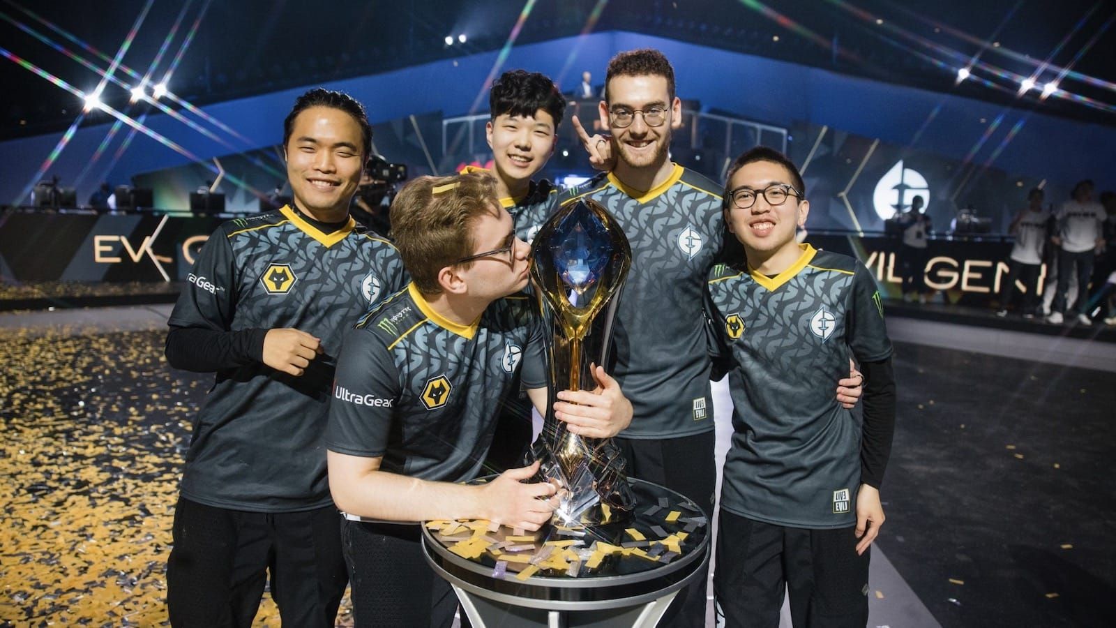 Evil Geniuses League of Legends team poses on stage with the LCS spring championship trophy
