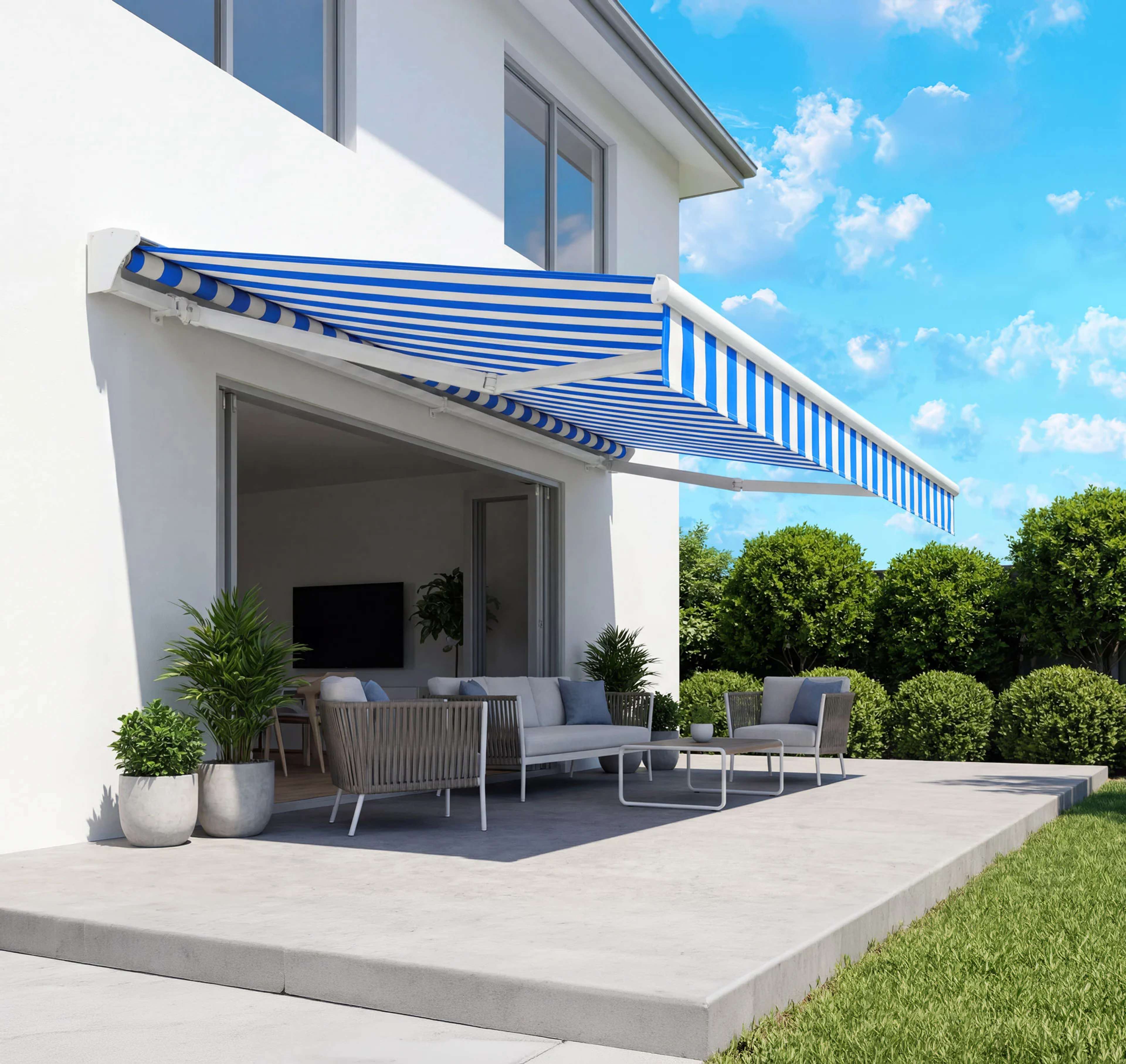Blue-and-white retractable awning extended over a furnished modern patio.