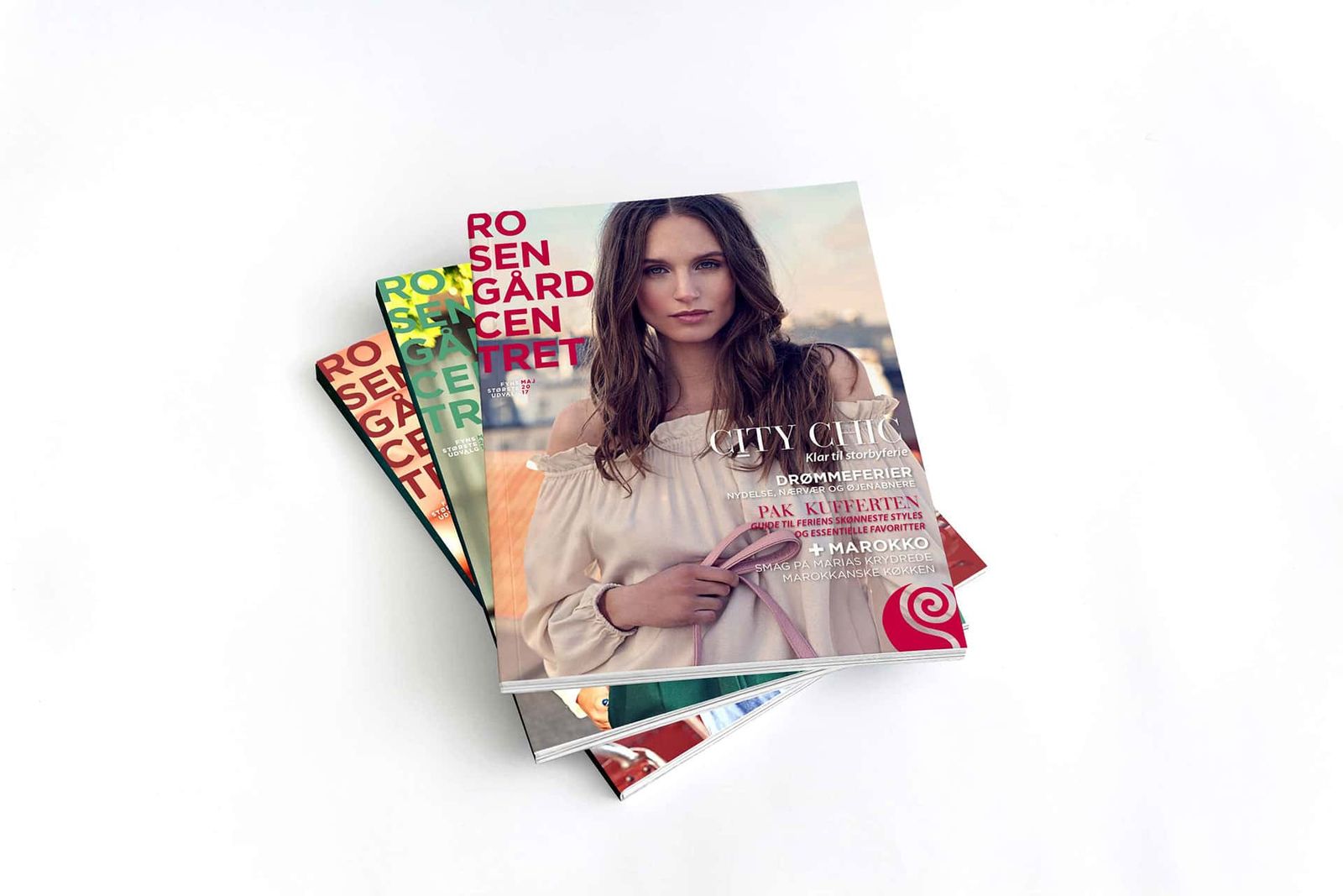 Magazine cover design featuring layered typography and editorial styling for shopping center promotion