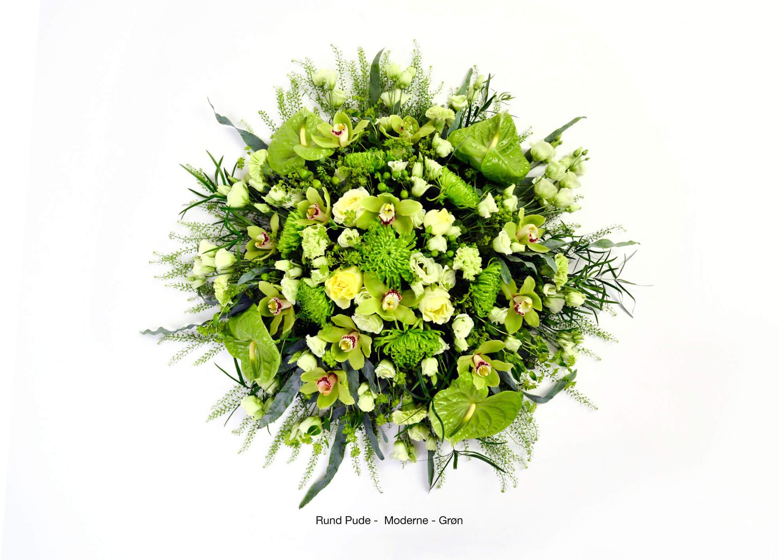 Product photography of green funeral arrangement featuring orchids, chrysanthemums and decorative foliage