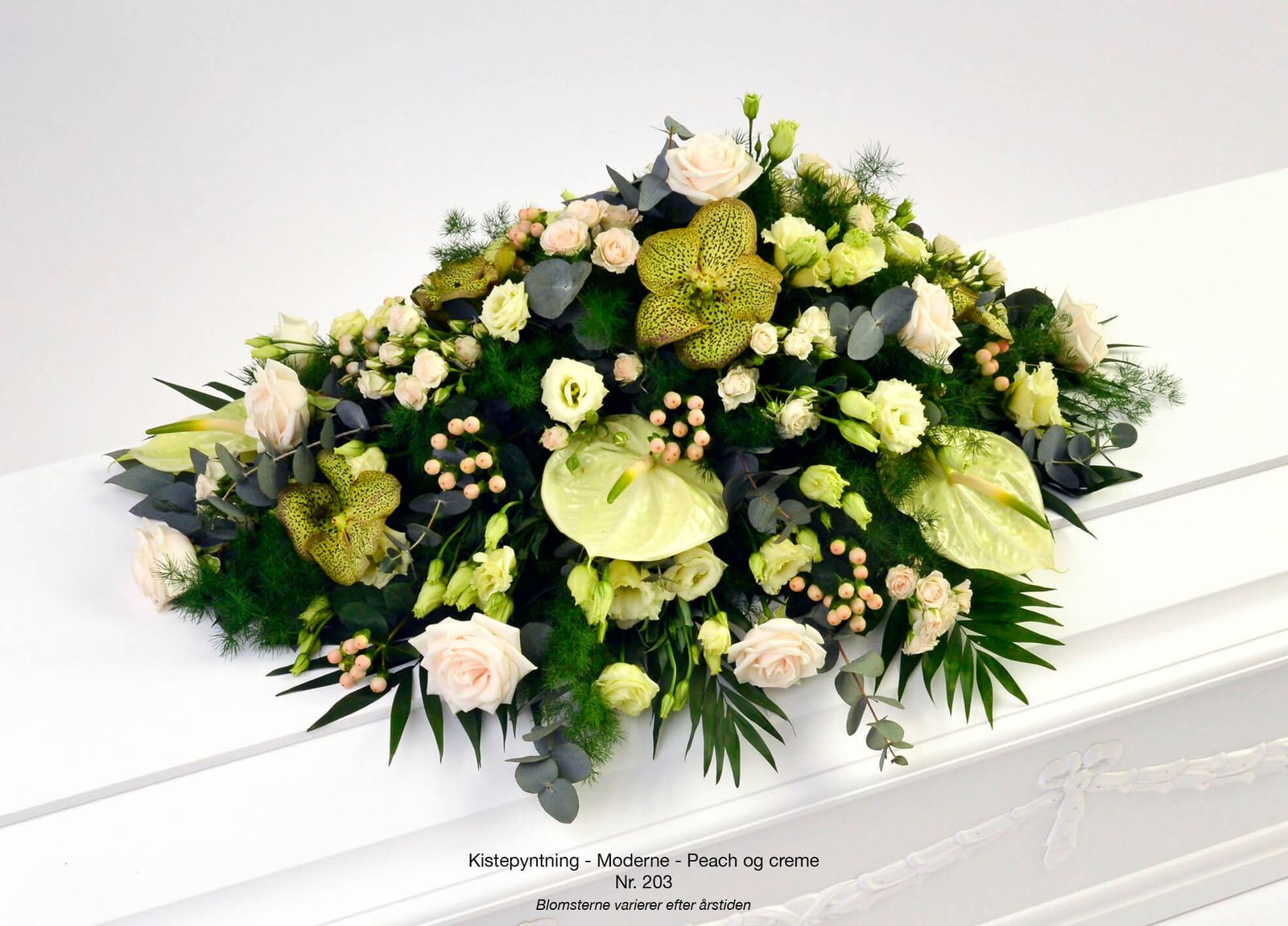 Catalog photography showcasing green and peach floral arrangements for funeral service brochure