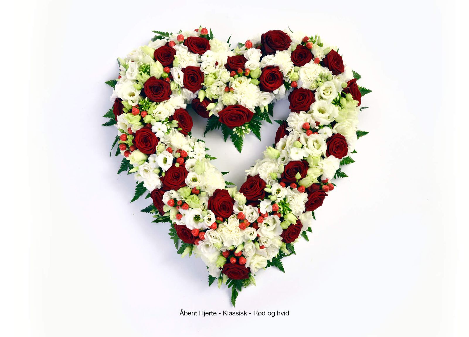 Floral arrangement layout featuring red roses and white flowers for funeral service catalog