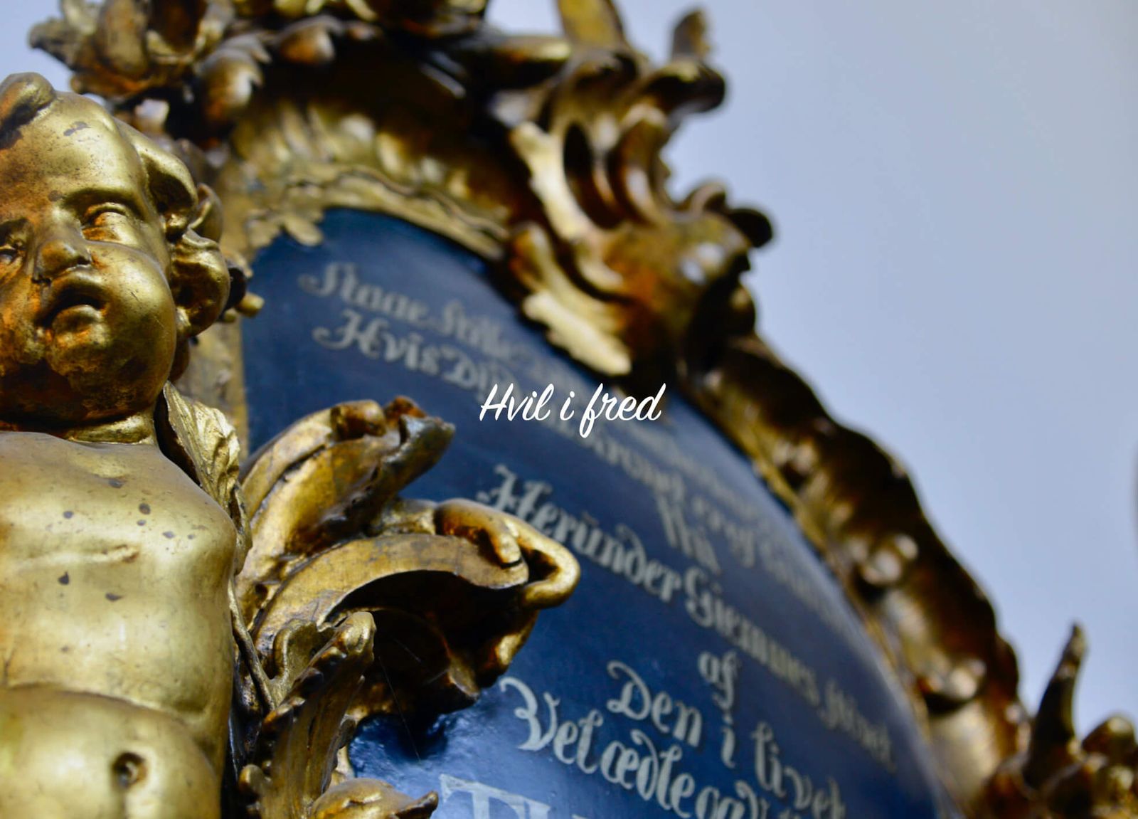 Direct mail design featuring gold-embossed floral arrangements against blue background for memorial catalogue