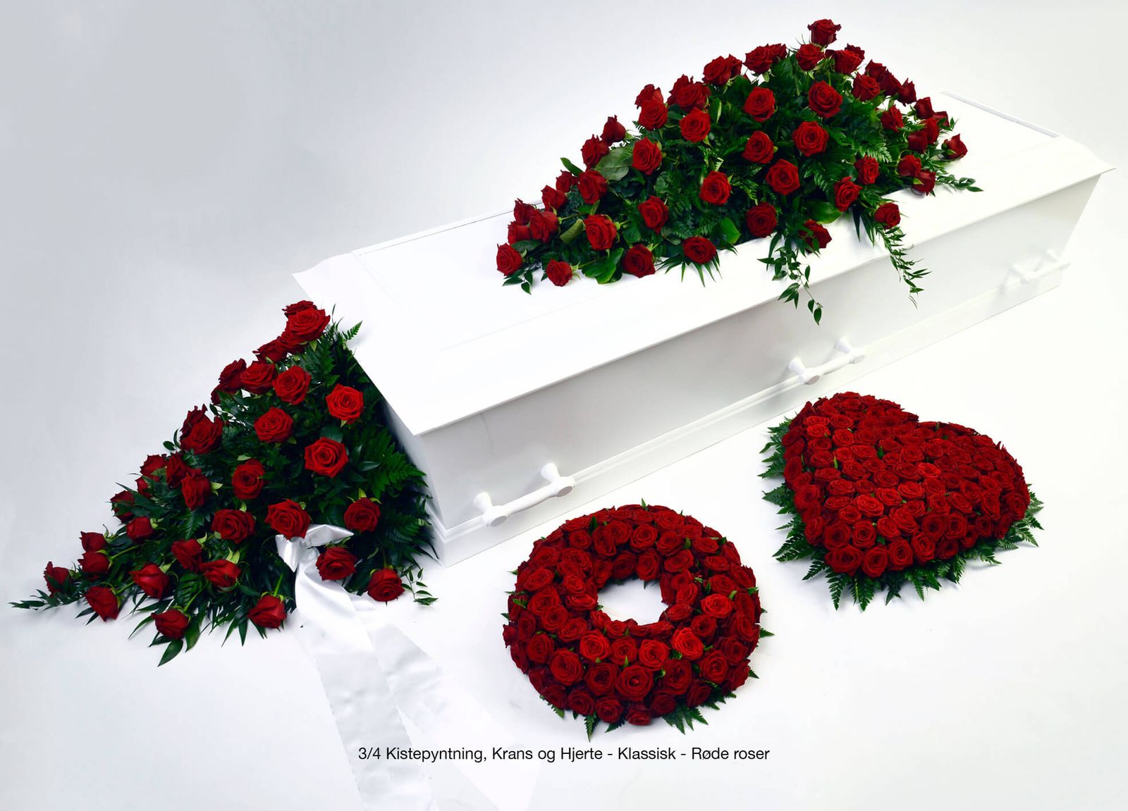 Art direction showcasing red rose funeral arrangements in dignified catalogue design