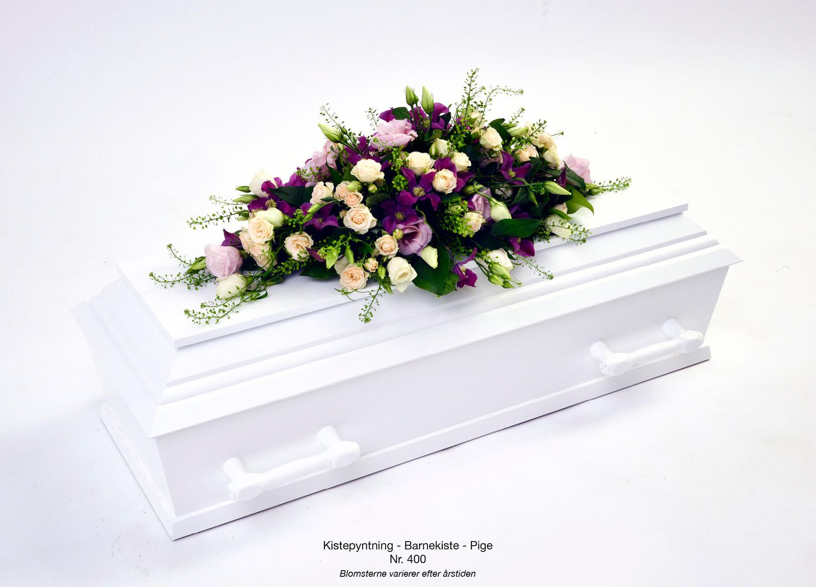 Product photography and graphic layout showcasing purple orchids, carnations and foliage arranged on casket display