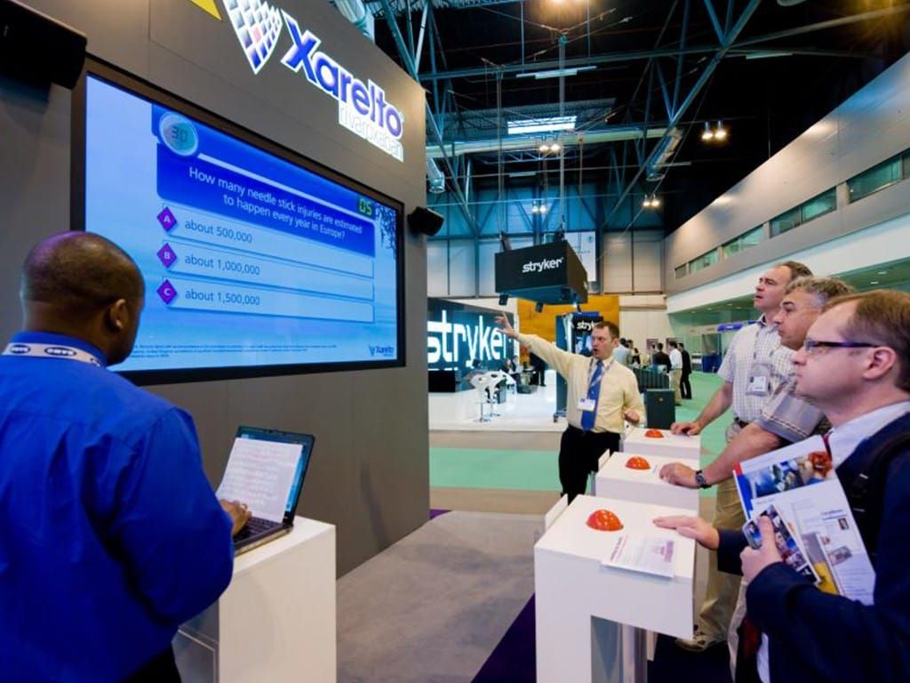 Exhibition stand interface displaying Xarelto quiz dashboard with interactive pharmaceutical presentation for healthcare conference
