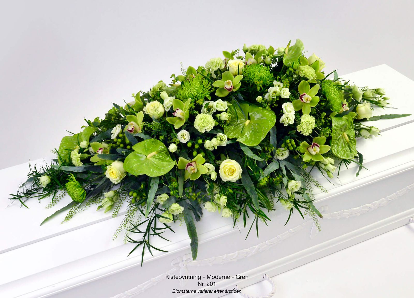 Product photography layout showcasing green orchids, roses and foliage for funeral flower catalogue design