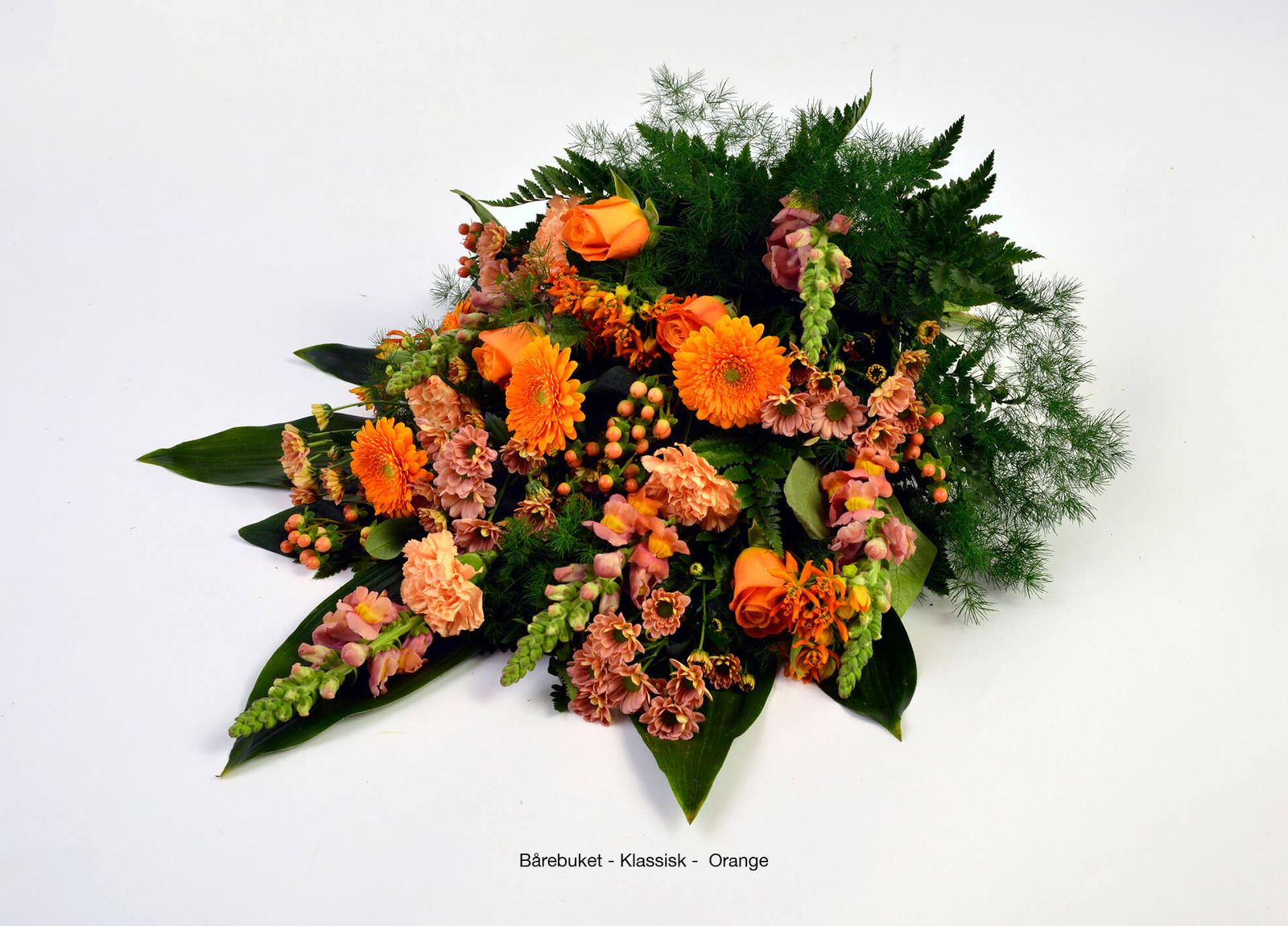 Orange gerbera and carnation arrangement showcasing funeral floral design in dignified product photography composition