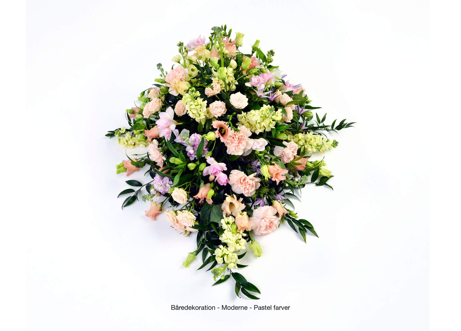 Catalog photography showcasing pastel-colored funeral wreath arrangement with roses, carnations and greenery