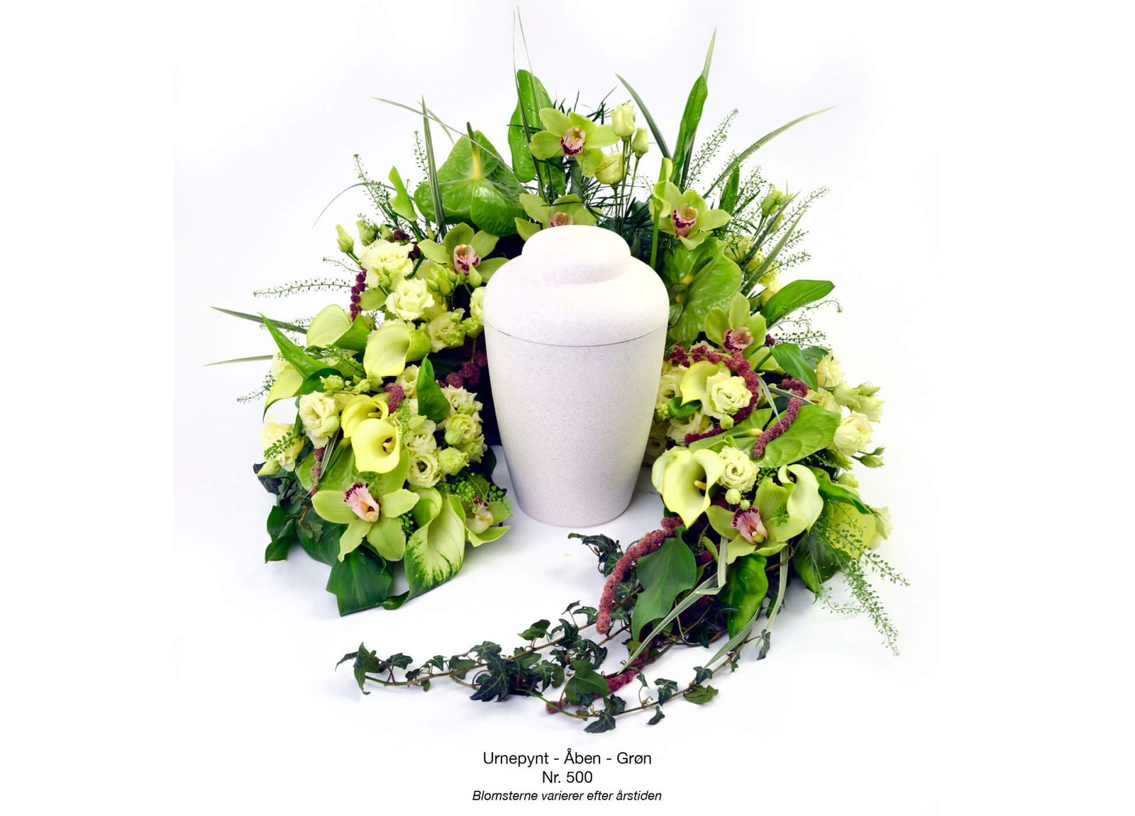 Still life composition and art direction of green cymbidium orchid funeral arrangement with foliage