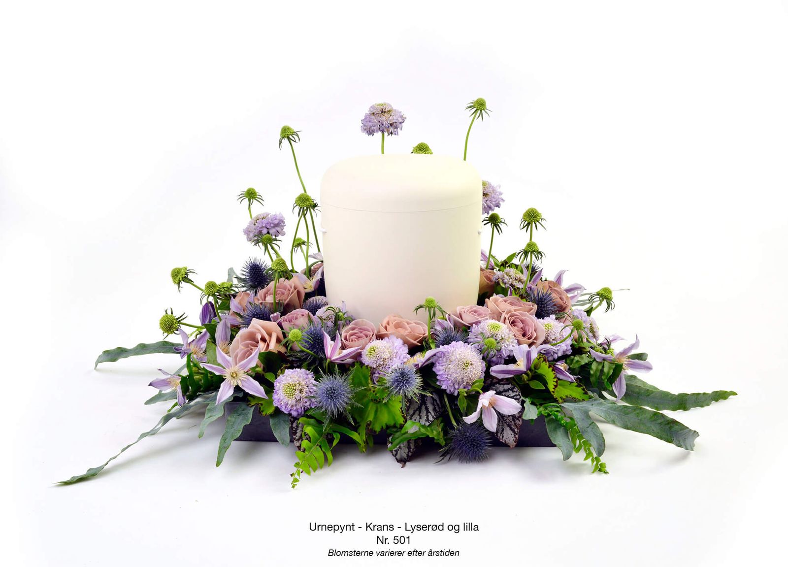 Product photography and art direction of purple and blush floral funeral arrangements in memorial catalog