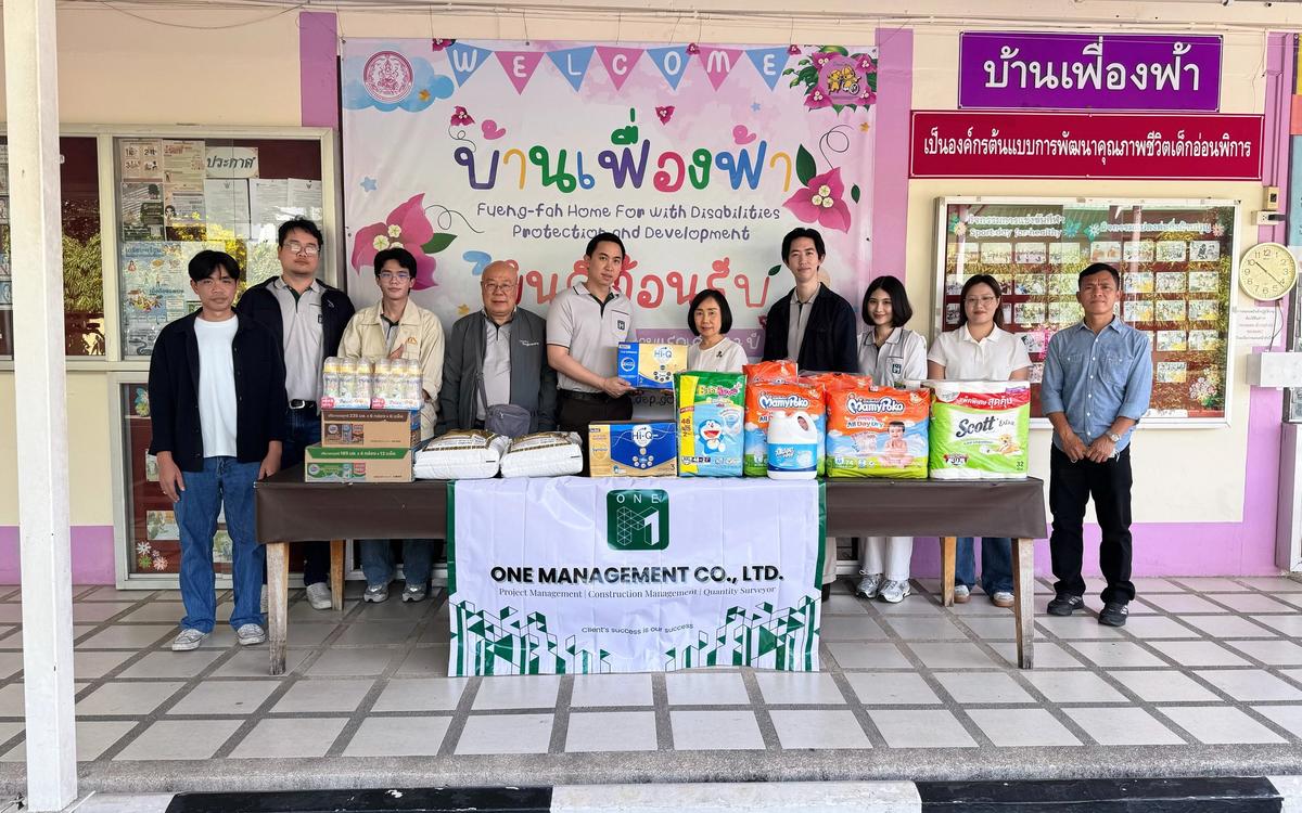 ONE-M team members presenting essential supplies during a CSR activity at Ban Fueng Fah Home for the Disabled in Nonthaburi.