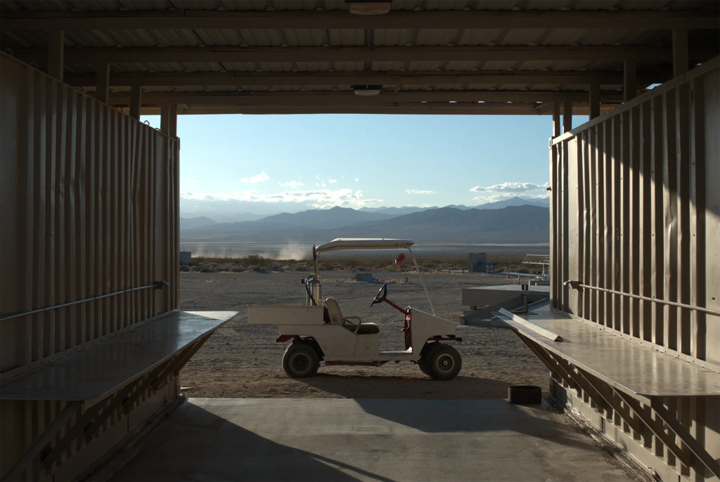 Golf cart in front of the mojave desert at the Friends of Amateur Rocketry launch site