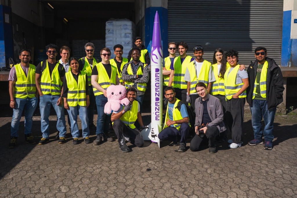A team of ASTRAnauts posing around the descendence rocket before driving to the launch site