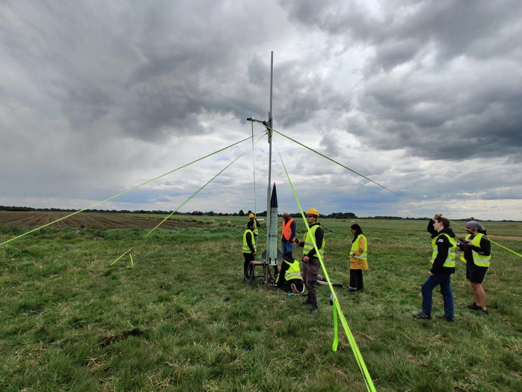 Ascendance mounted on erected launch rail on an airstrip.