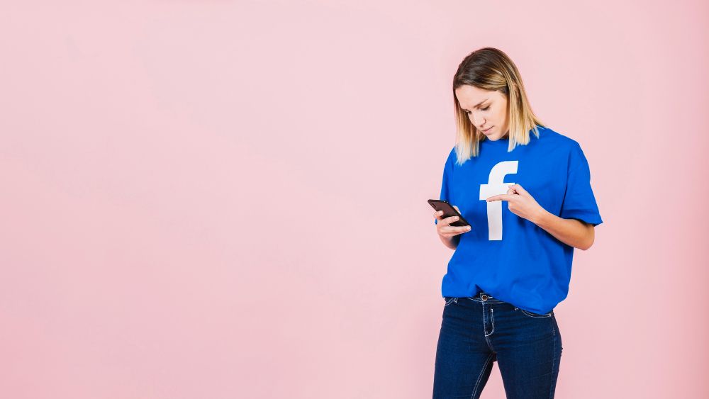 A woman wearing a Facebook t-shirt