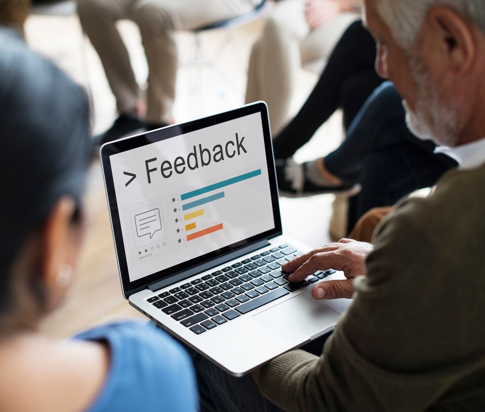 A laptop screen shows feedback ratings and bar charts, illustrating website content strategy.