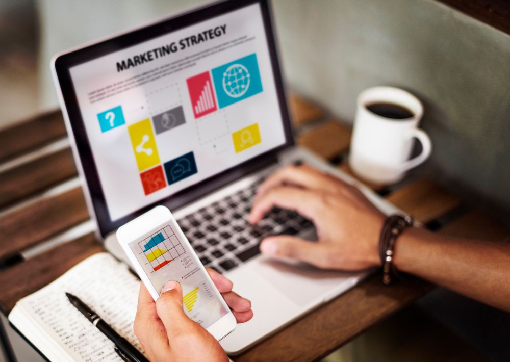 marketing on a laptop and phone screen