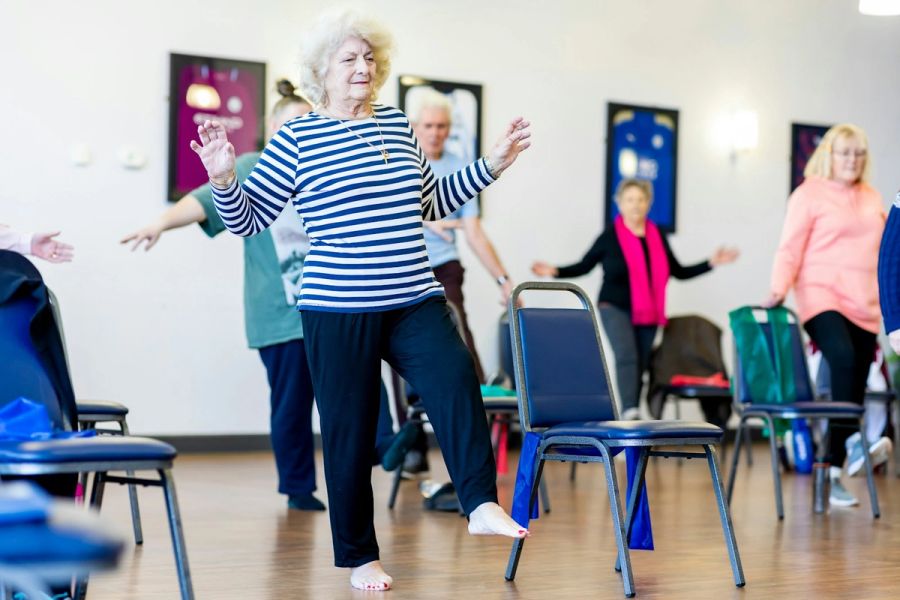 Older adults staying active in a gentle group session