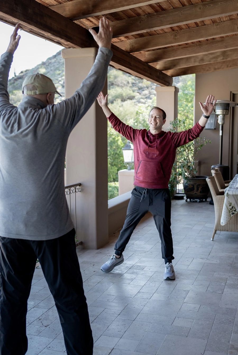 A man and woman working through a training session together