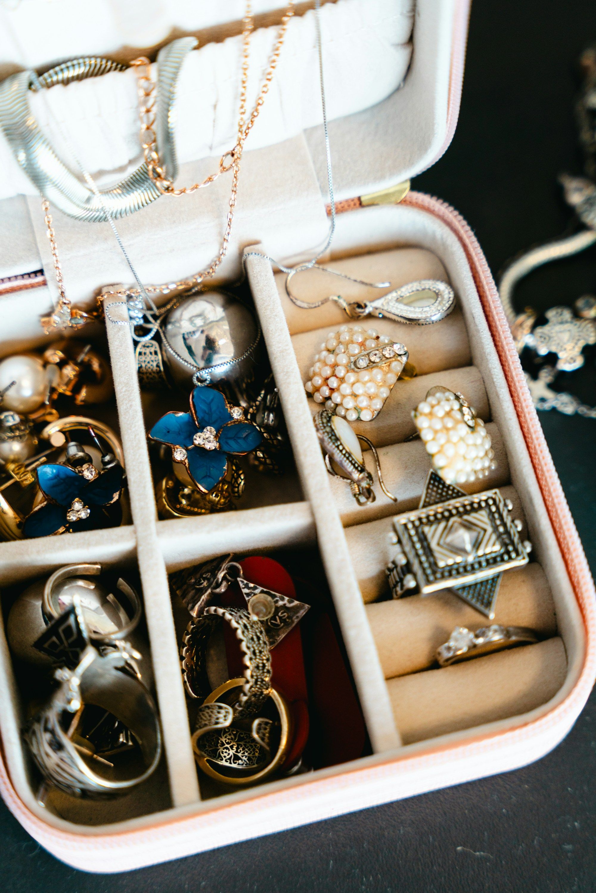 A jewellery box filled with necklaces, rings and earrings