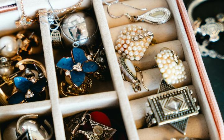 A jewellery box filled with necklaces, rings and earrings