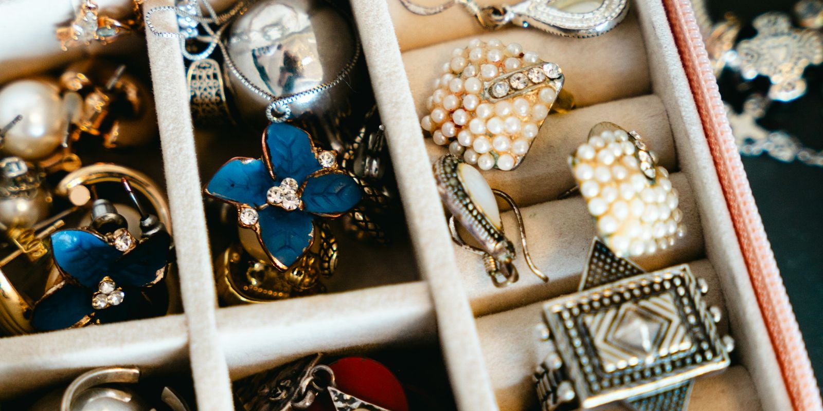 A jewellery box filled with necklaces, rings and earrings