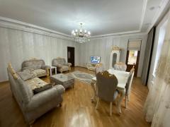 Living room — chandelier, sofa set and window curtains