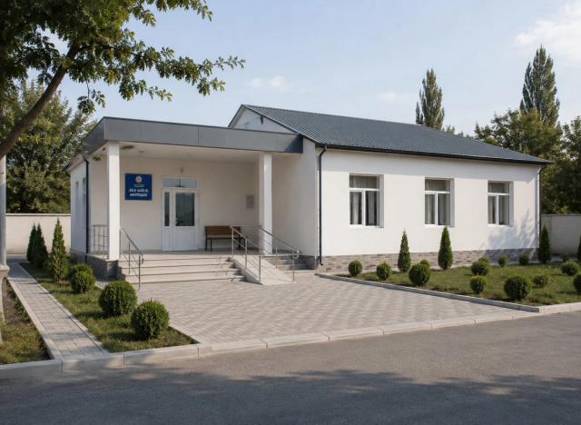 A family health centre building after renovation — a white plastered facade, a dark roof covering, a covered entrance, a ramp and a new pavement
