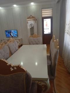 Living and dining area — television wall and mirrored section