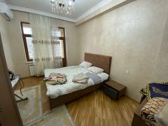 Bedroom — bed and a wall-mounted air conditioner