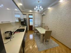 Kitchen — white kitchen units and dining area