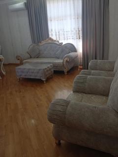 Sofa set, curtains and parquet flooring