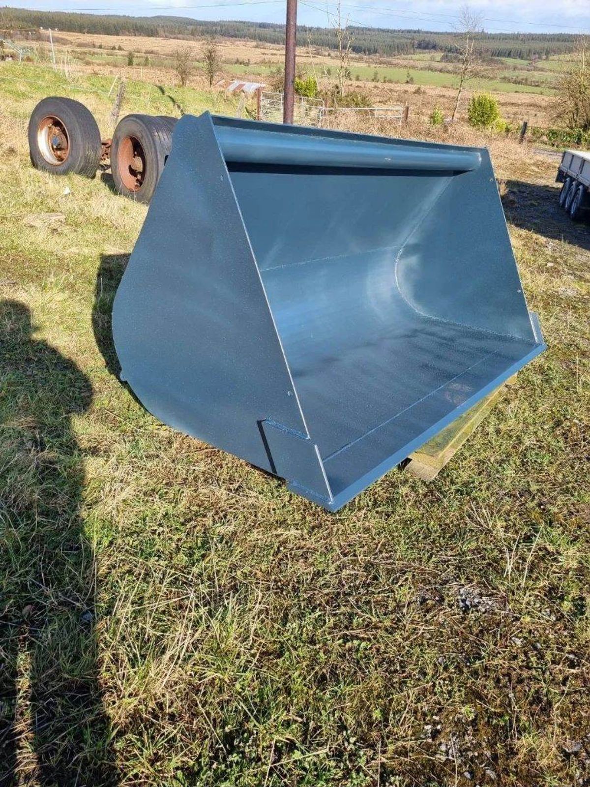 Painted loader bucket on grass