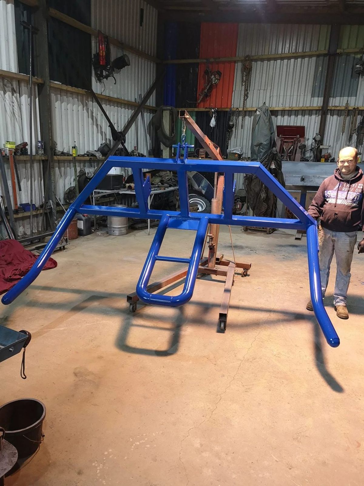 Blue double sided bale lifter frame finished in the workshop