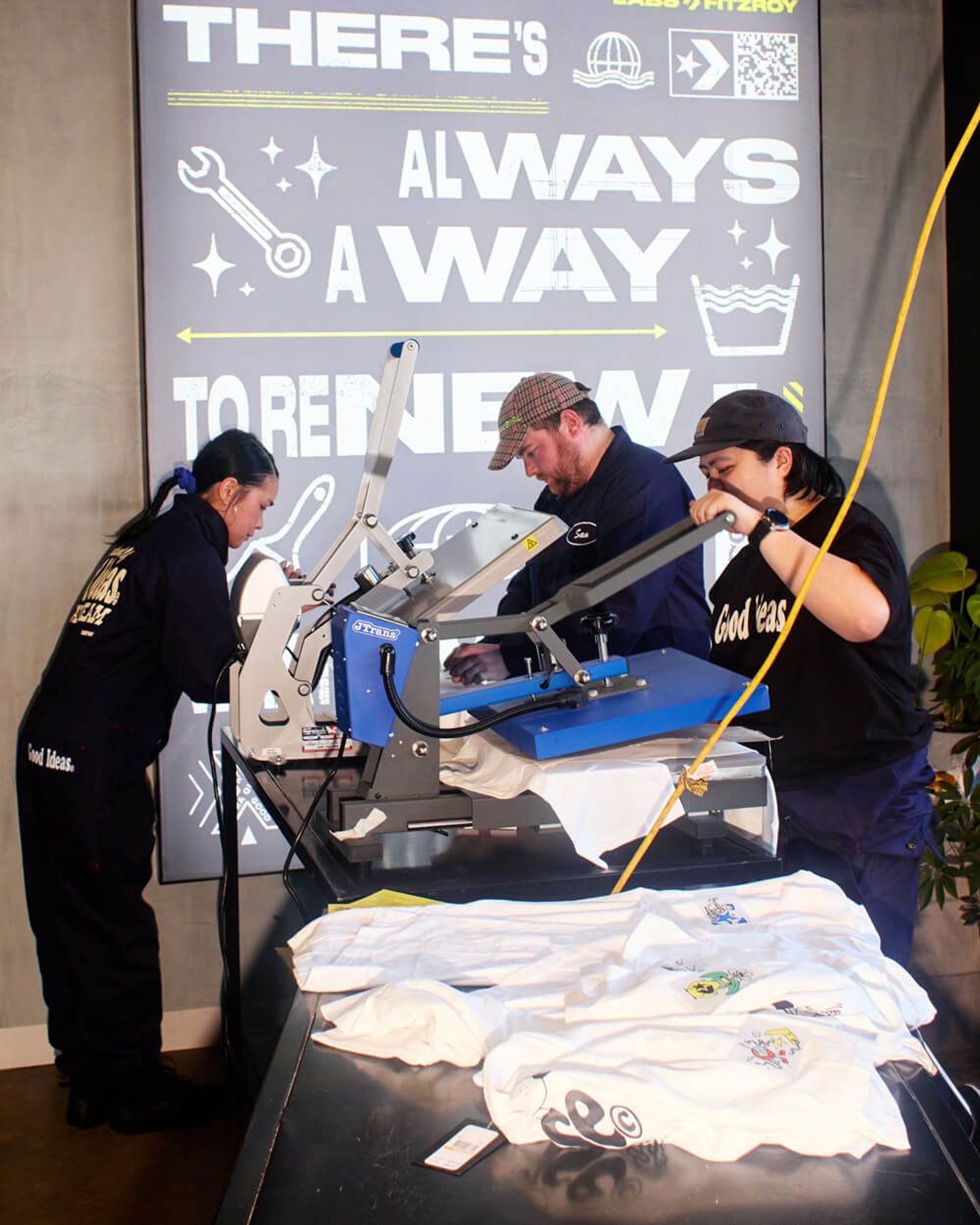 Converse team using a heat press