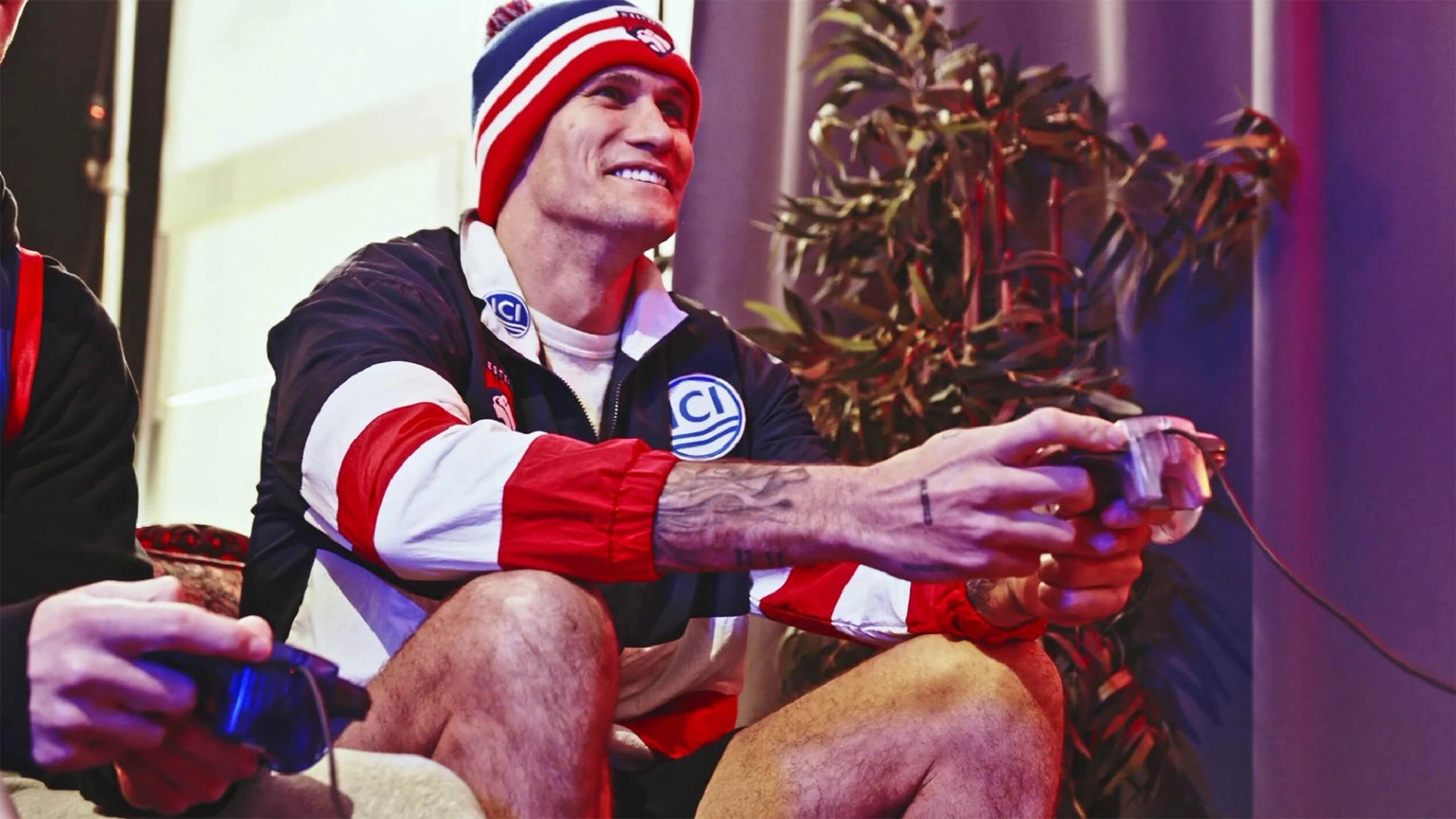 Bulldogs players holding a video game controller