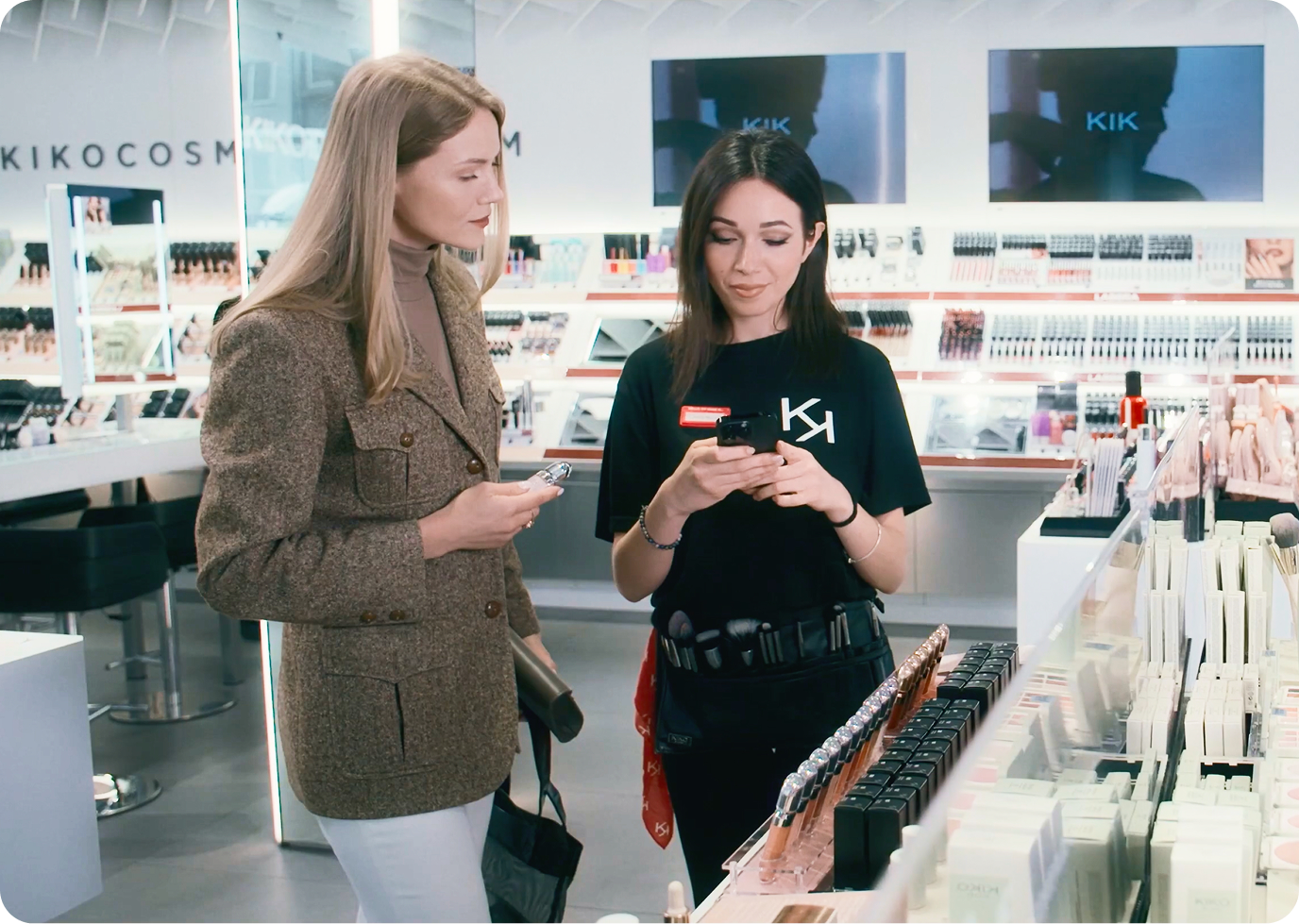 KIKO Milano store associate helping customer using EVA mPOS