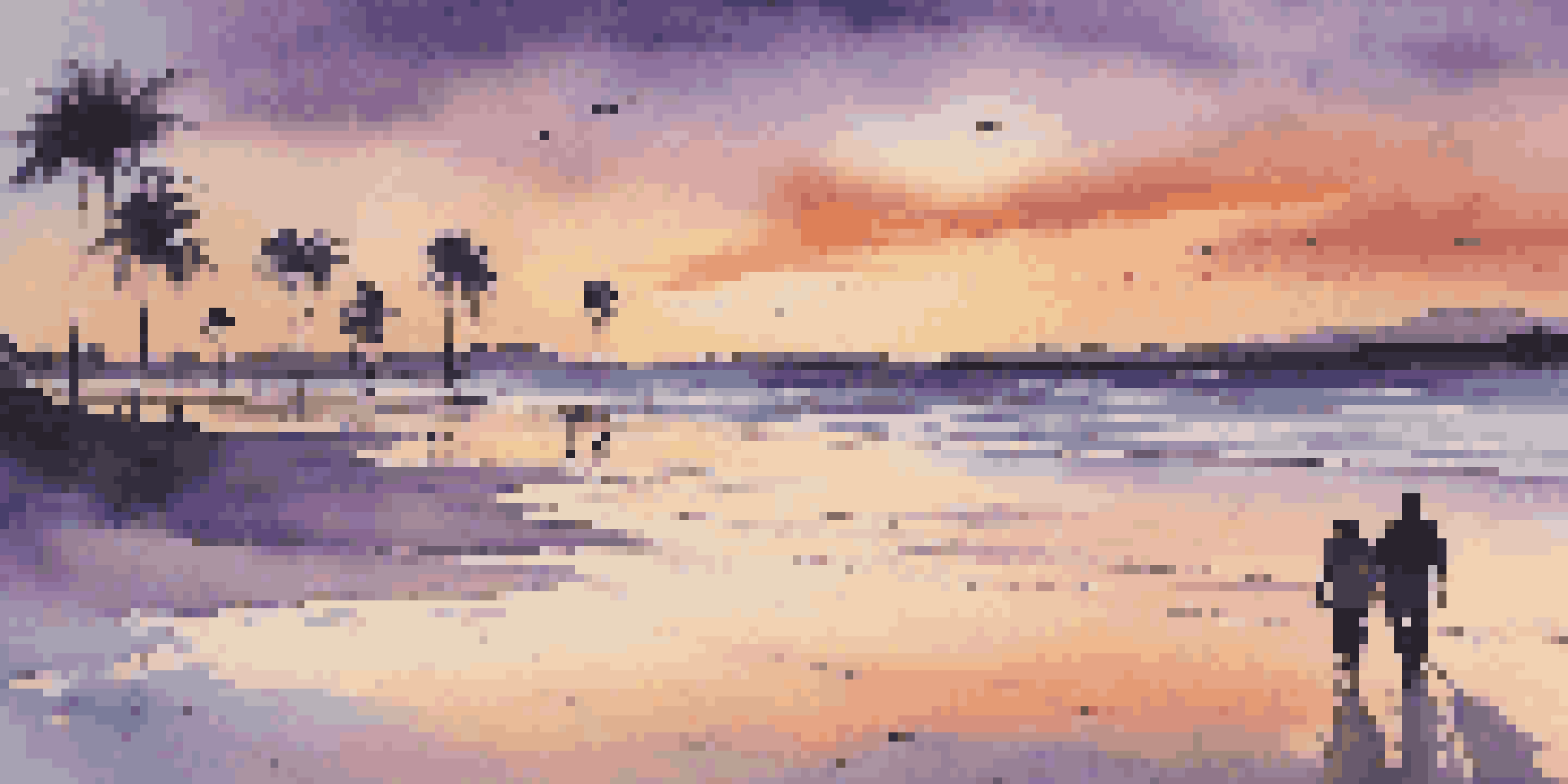 A beautiful sunset over a calm beach with palm trees and a couple walking on the sand.