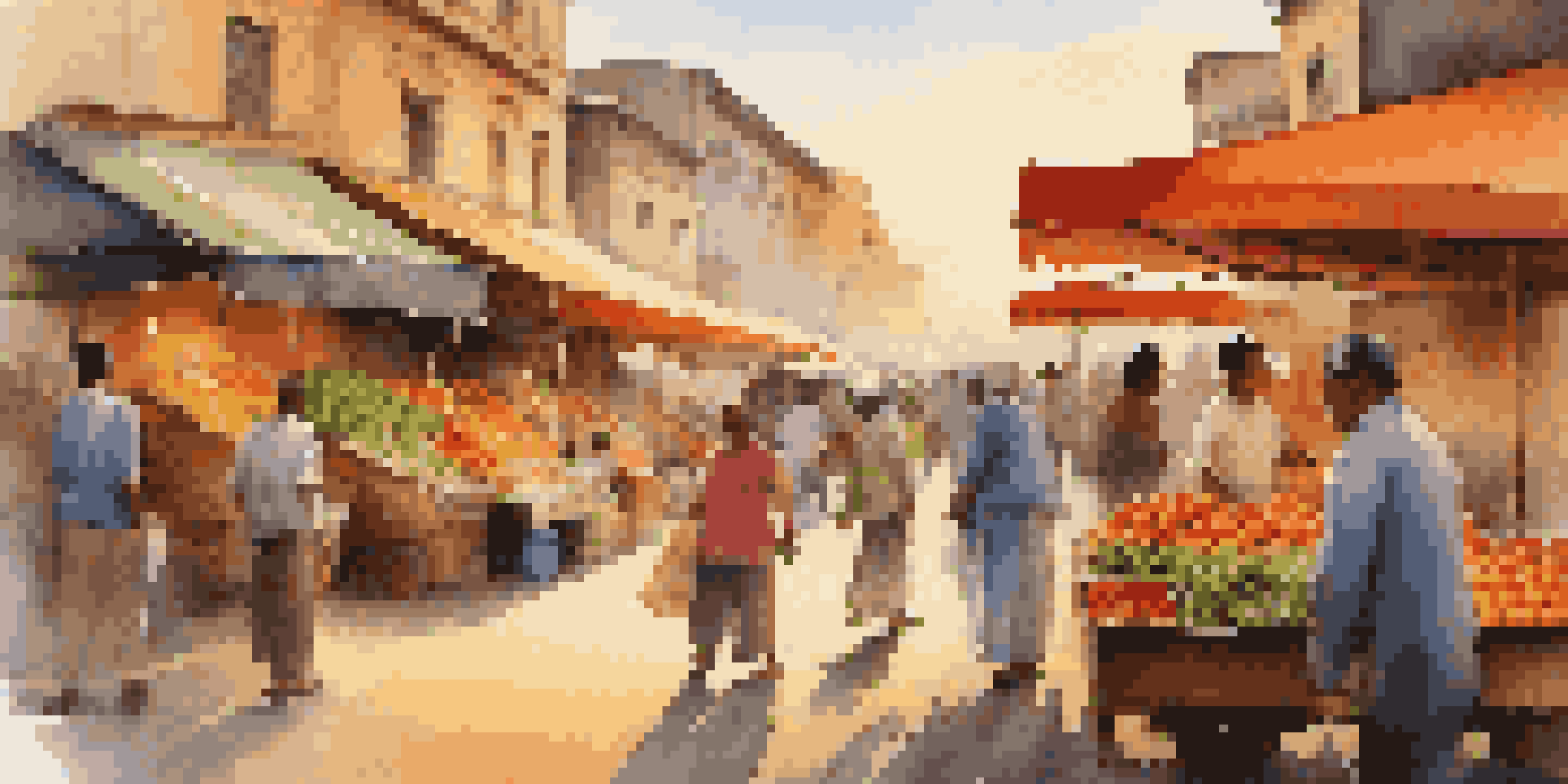 A local vendor in a colorful market, with a blurred crowd behind them, captured during sunset.