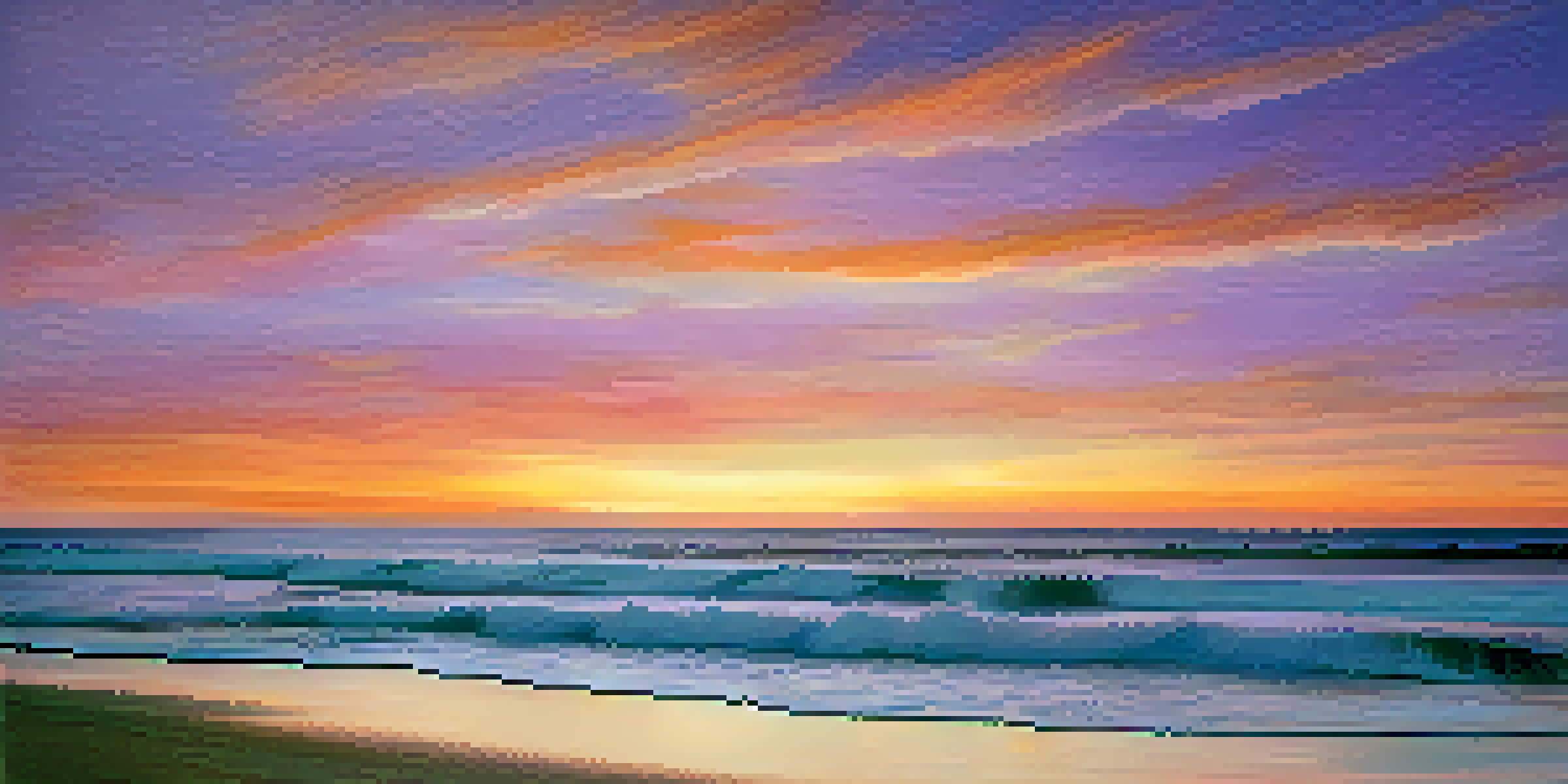 A tranquil beach at sunset with smooth waves and vibrant sky colors.