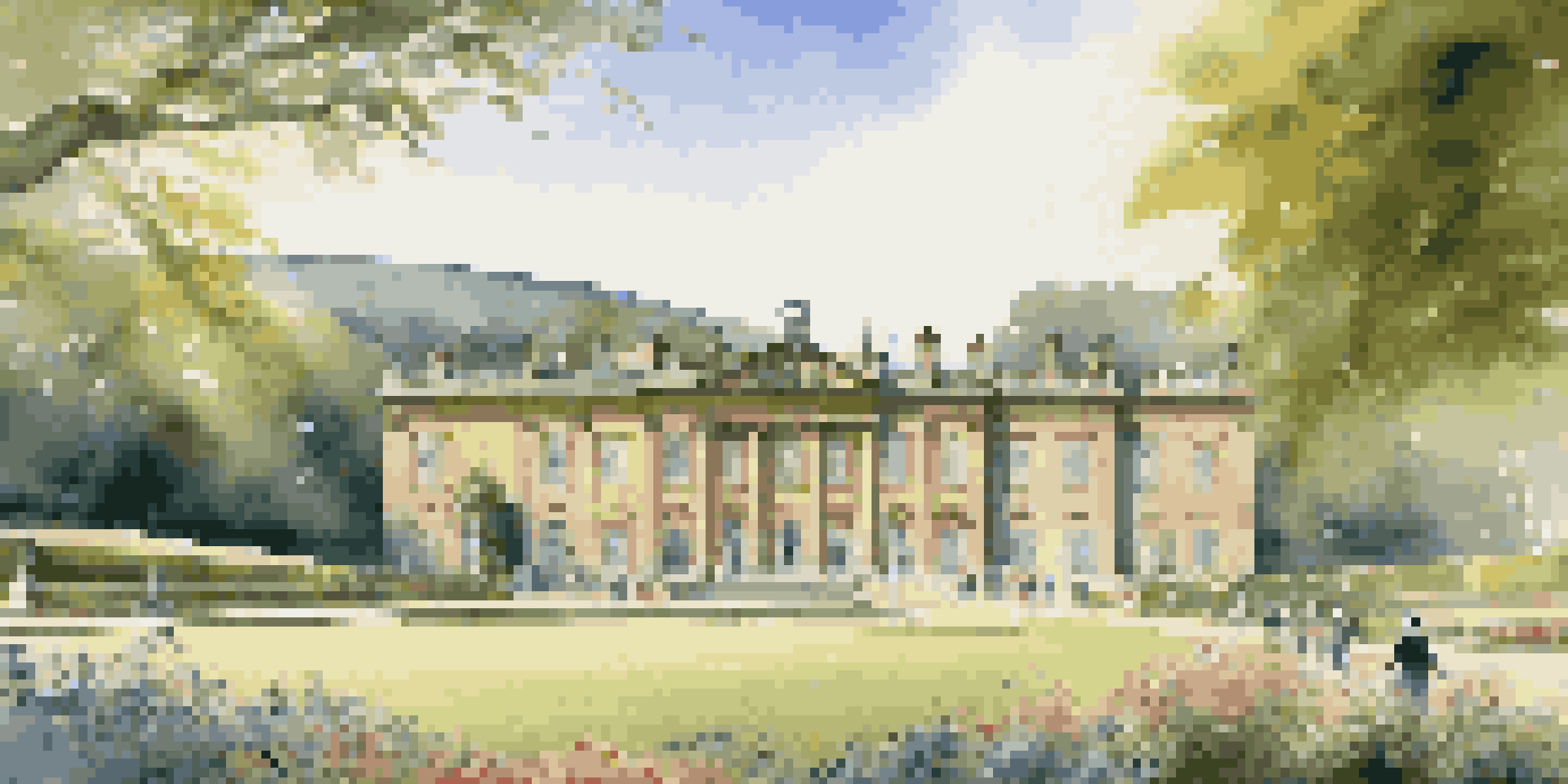 A couple in Regency-era clothing walking through the beautiful gardens of Chatsworth House, with the house in the background and colorful flower beds.
