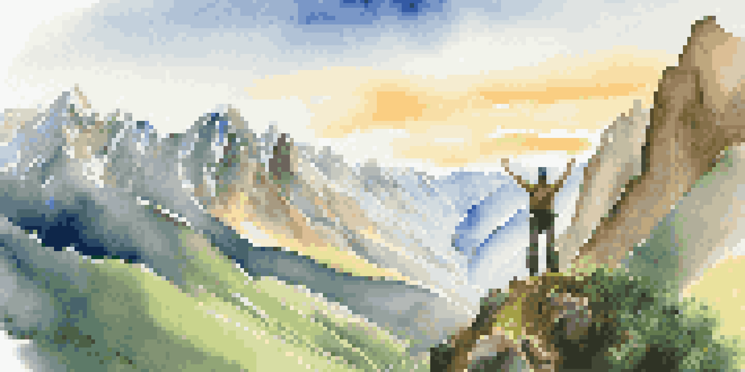 A hiker with arms raised stands at the edge of a cliff overlooking the Andes mountains at sunrise.