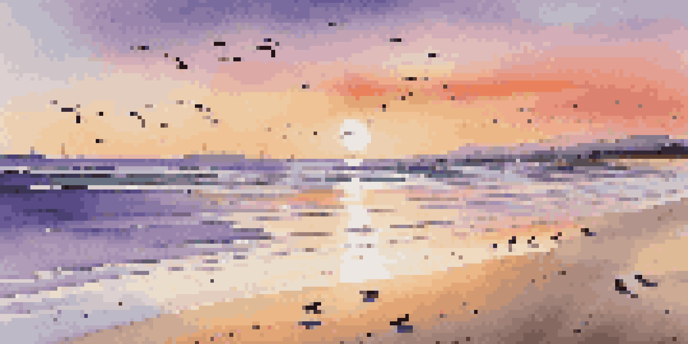 A beach at golden hour with warm sunlight, gentle waves, and a colorful sky filled with orange, pink, and purple hues.
