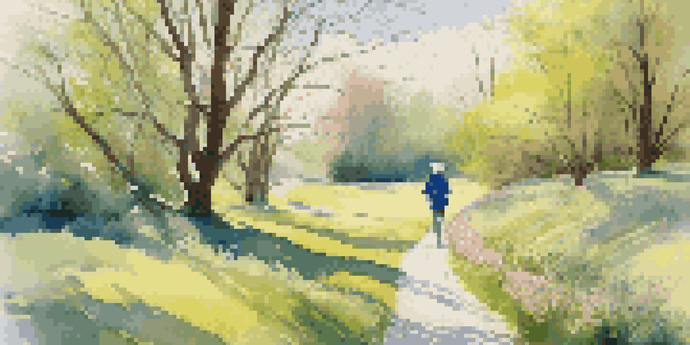 A colorful spring scene with blooming flowers and a person walking on a path under the trees.